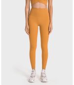 טייץ וטופ - Alo yoga set tights and top for women in orange color - Alo Yoga Set